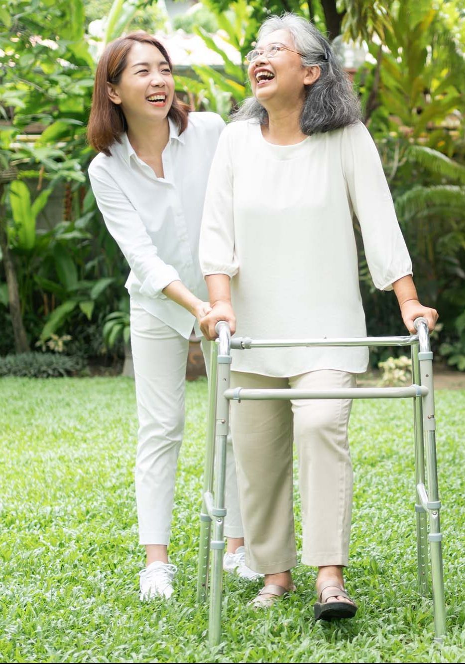 Smiling elderly woman and carer